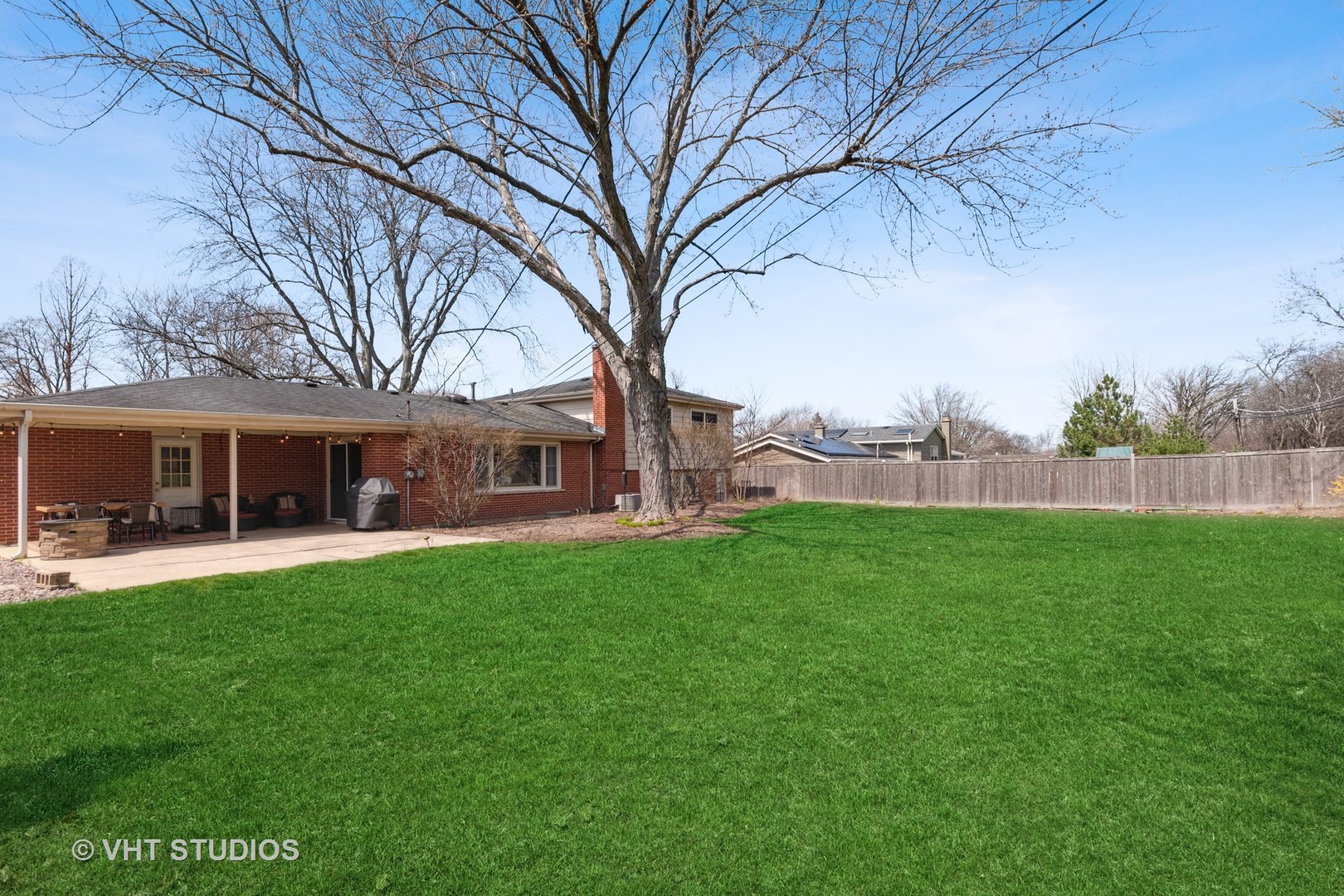 271 Beverly Road Barrington, IL 60010 - Photo 17 of 18 a backyard of a house with table and chairs