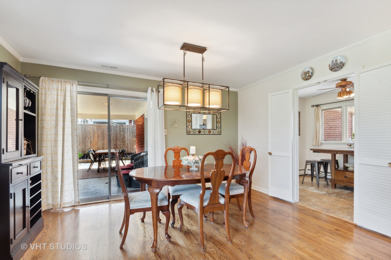 271 Beverly Road Barrington, IL 60010 - Photo 6 of 18 a dining room with furniture a chandelier and wooden floor