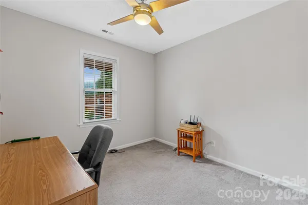 a room with gym equipment and a window