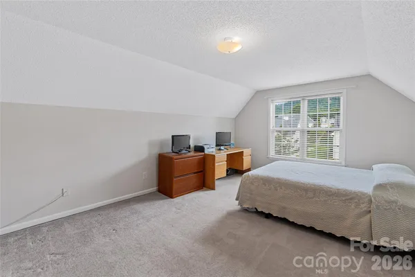 a bed room with a bed and a couch