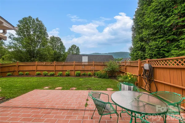 a view of a table and chairs in patio