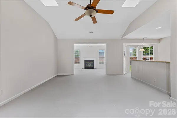 an empty room with a empty space and windows