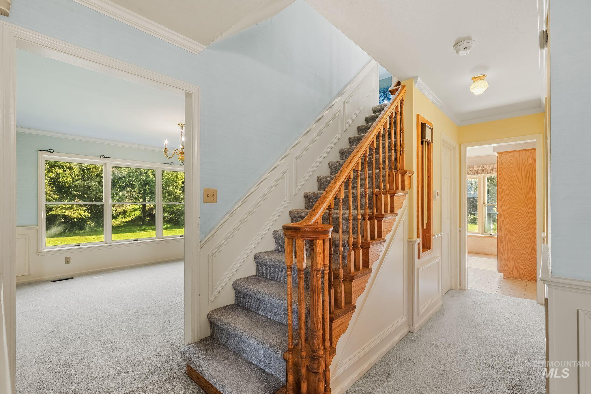 531 Silcott Road Clarkston, WA 99403 - Photo 16 of 43 Carpeted staircase with wood spindle railing and newel posts