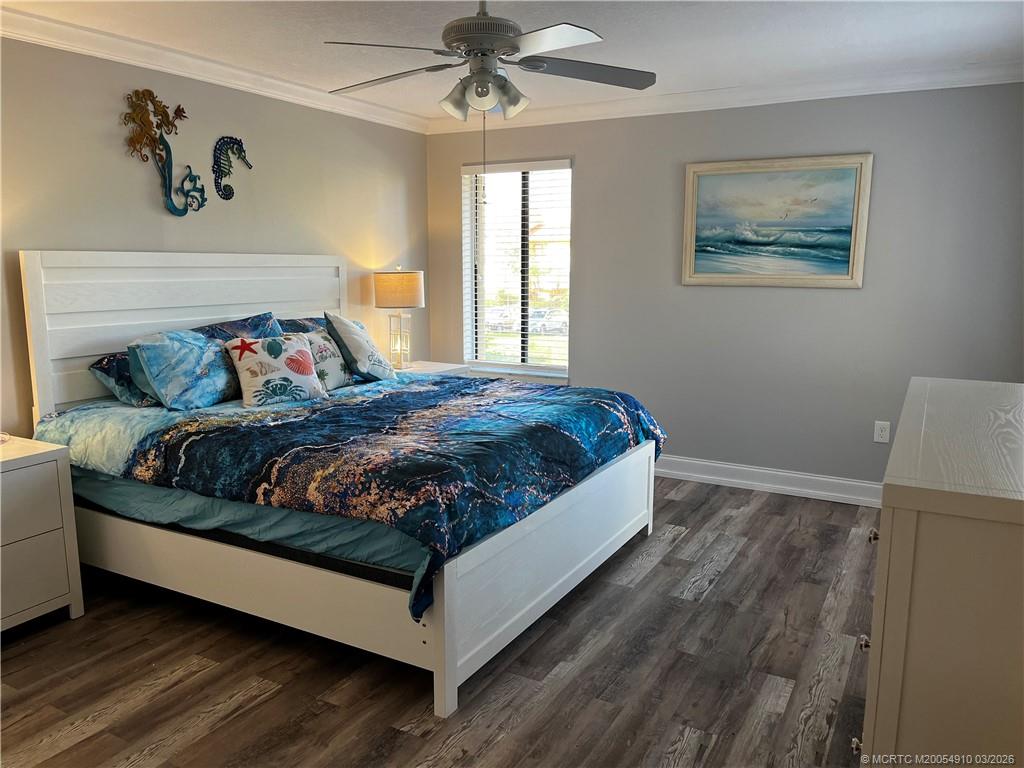 5323 Southeast Miles Grant Road, Unit 206 Stuart, FL 34997 - Photo 10 of 20 a bedroom with a bed and window