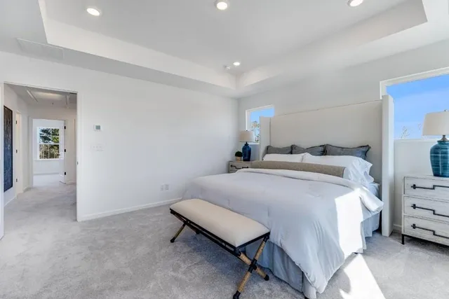 a bathroom with a double vanity sink mirror and shower