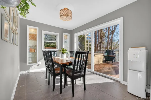 a view of a dining room with furniture a livingroom and outdoor view