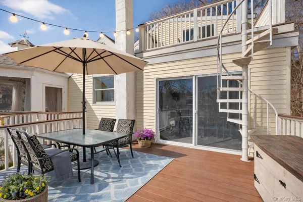 a patio with table and chairs