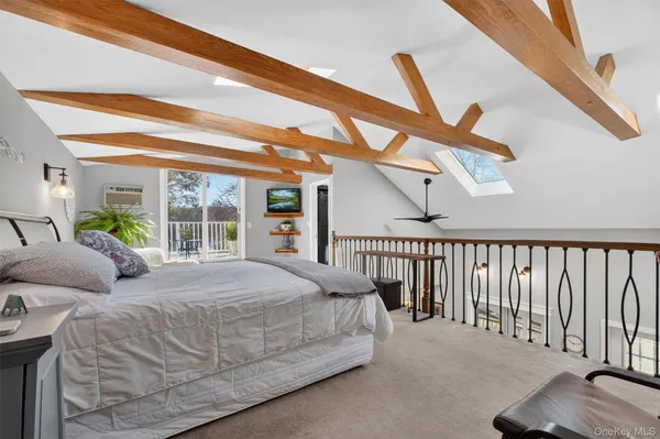 a bedroom with a bed window and ceiling fan