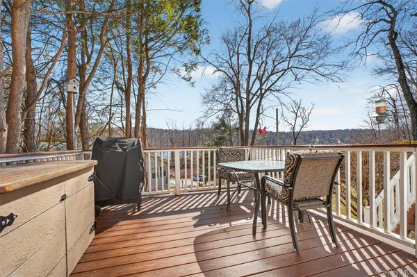 a view of a chairs and table on the deck
