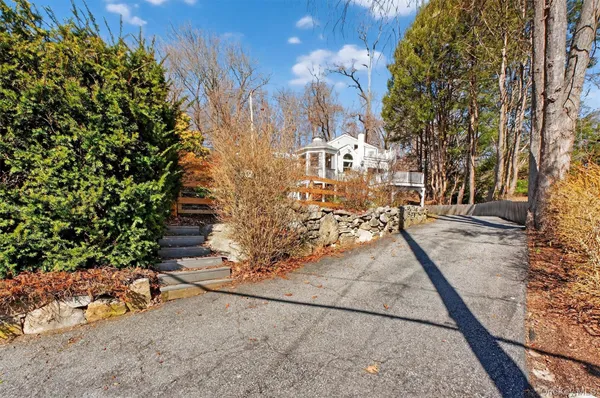 a view of a pathway with a yard