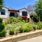 a front view of a house with yard