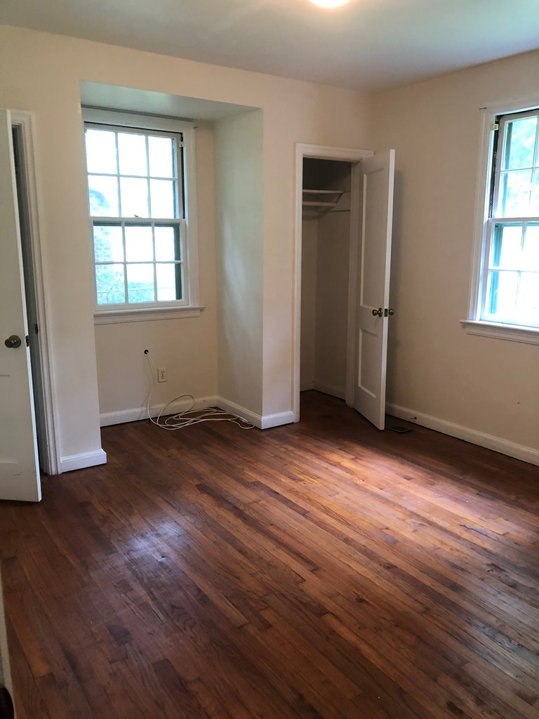 2834 Mimosa Street Columbus, GA 31906 - Photo 9 of 10 an empty room with wooden floor and windows