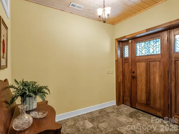 a kitchen with stainless steel appliances granite countertop a sink dishwasher and cabinets with wooden floor