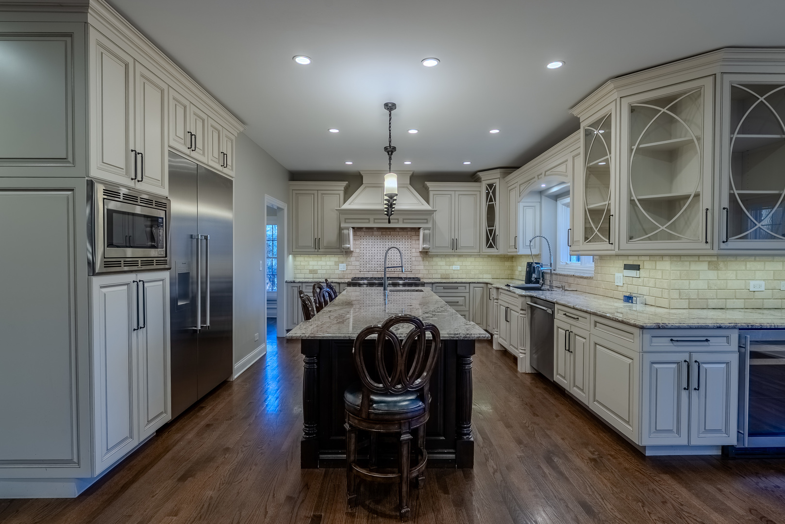 863 Bittersweet Drive Northbrook, IL 60062 - Photo 13 of 51 a kitchen with stainless steel appliances granite countertop a sink a stove a refrigerator and a microwave
