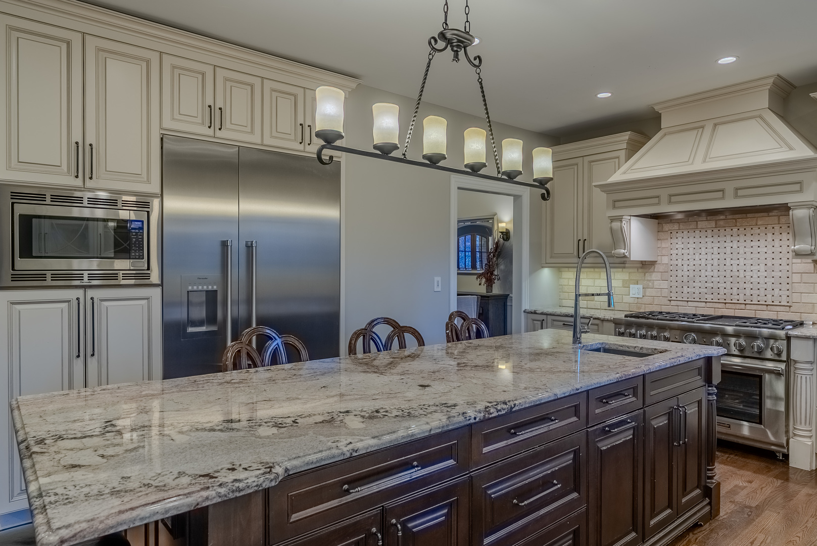863 Bittersweet Drive Northbrook, IL 60062 - Photo 14 of 51 a kitchen with stainless steel appliances granite countertop a sink a stove and a refrigerator
