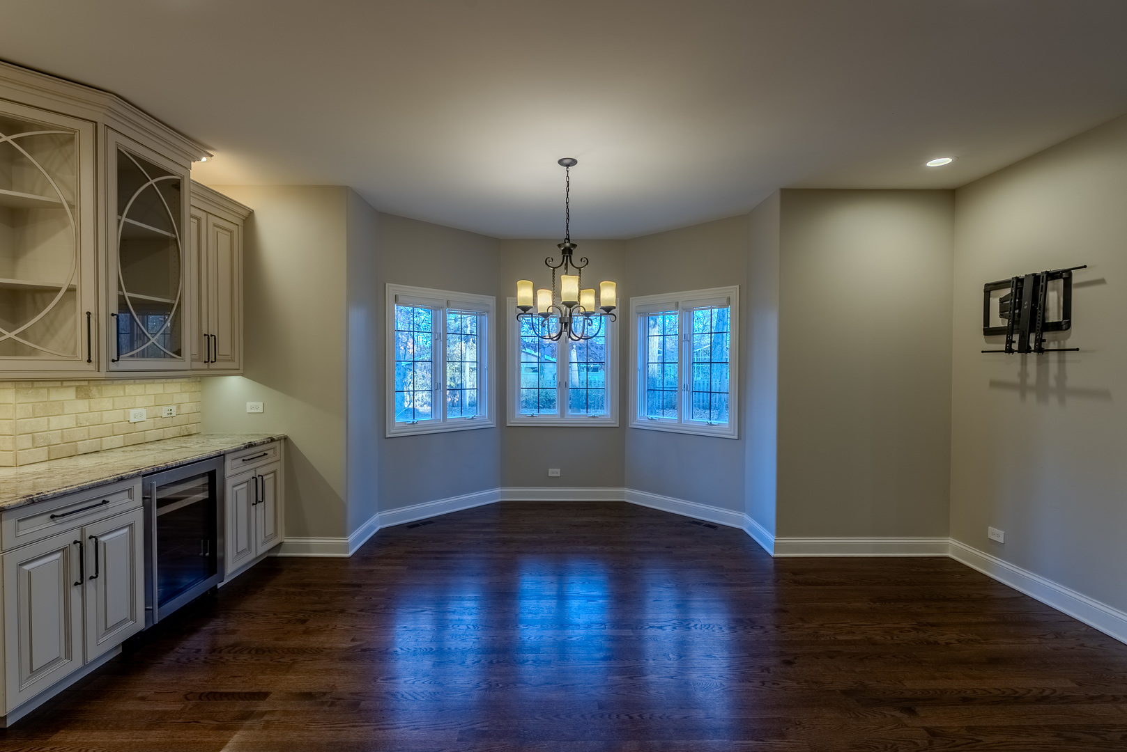 863 Bittersweet Drive Northbrook, IL 60062 - Photo 15 of 51 an empty room with wooden floor and chandelier