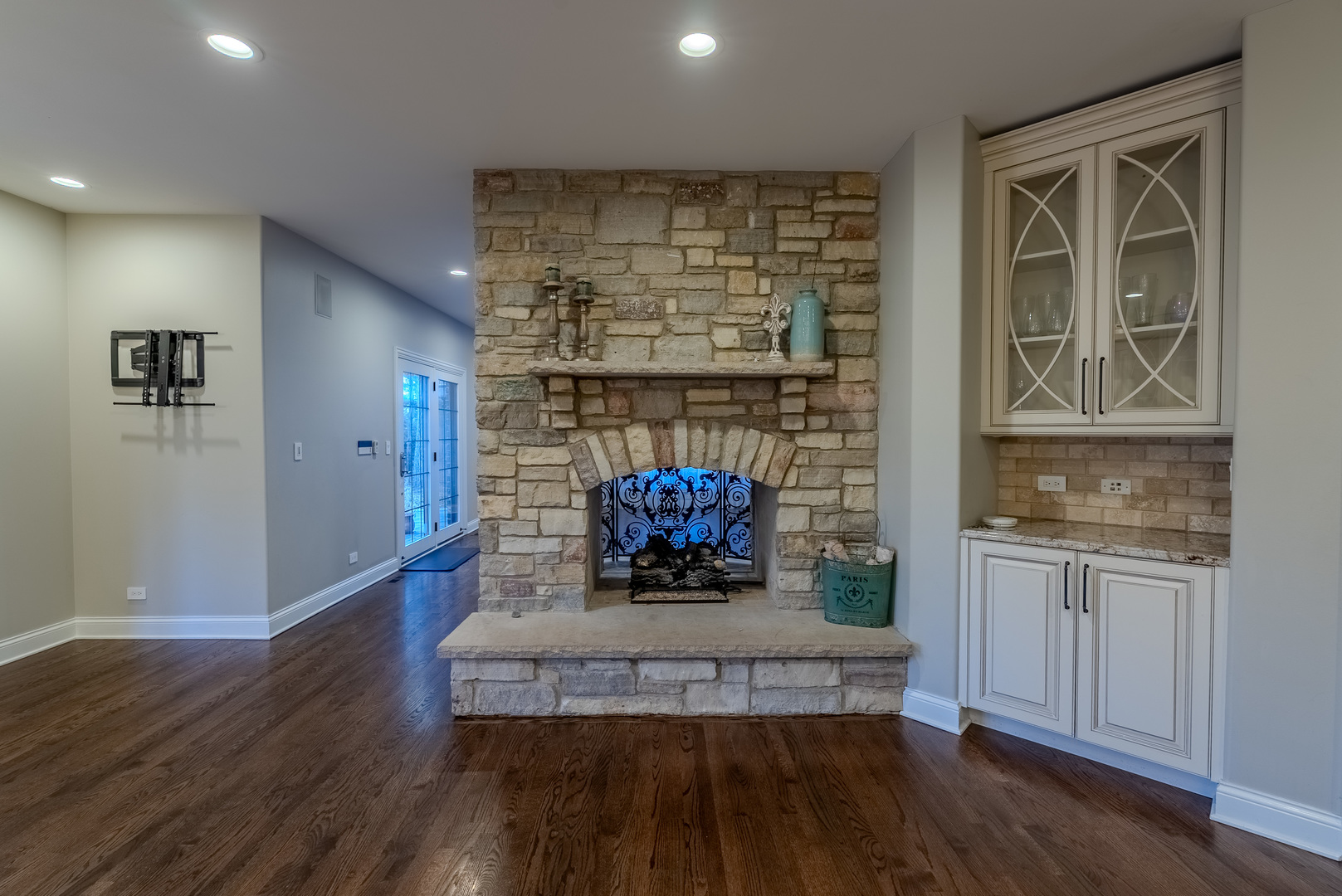 863 Bittersweet Drive Northbrook, IL 60062 - Photo 16 of 51 a living room with hard wood floors and a fireplace