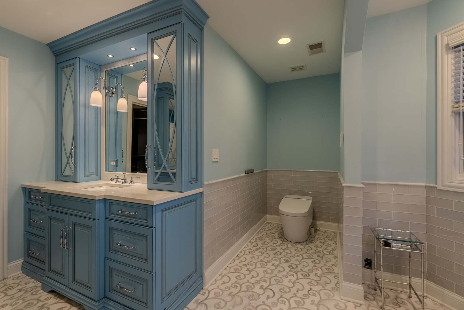 863 Bittersweet Drive Northbrook, IL 60062 - Photo 27 of 51 a bathroom with a granite countertop toilet a sink and a mirror