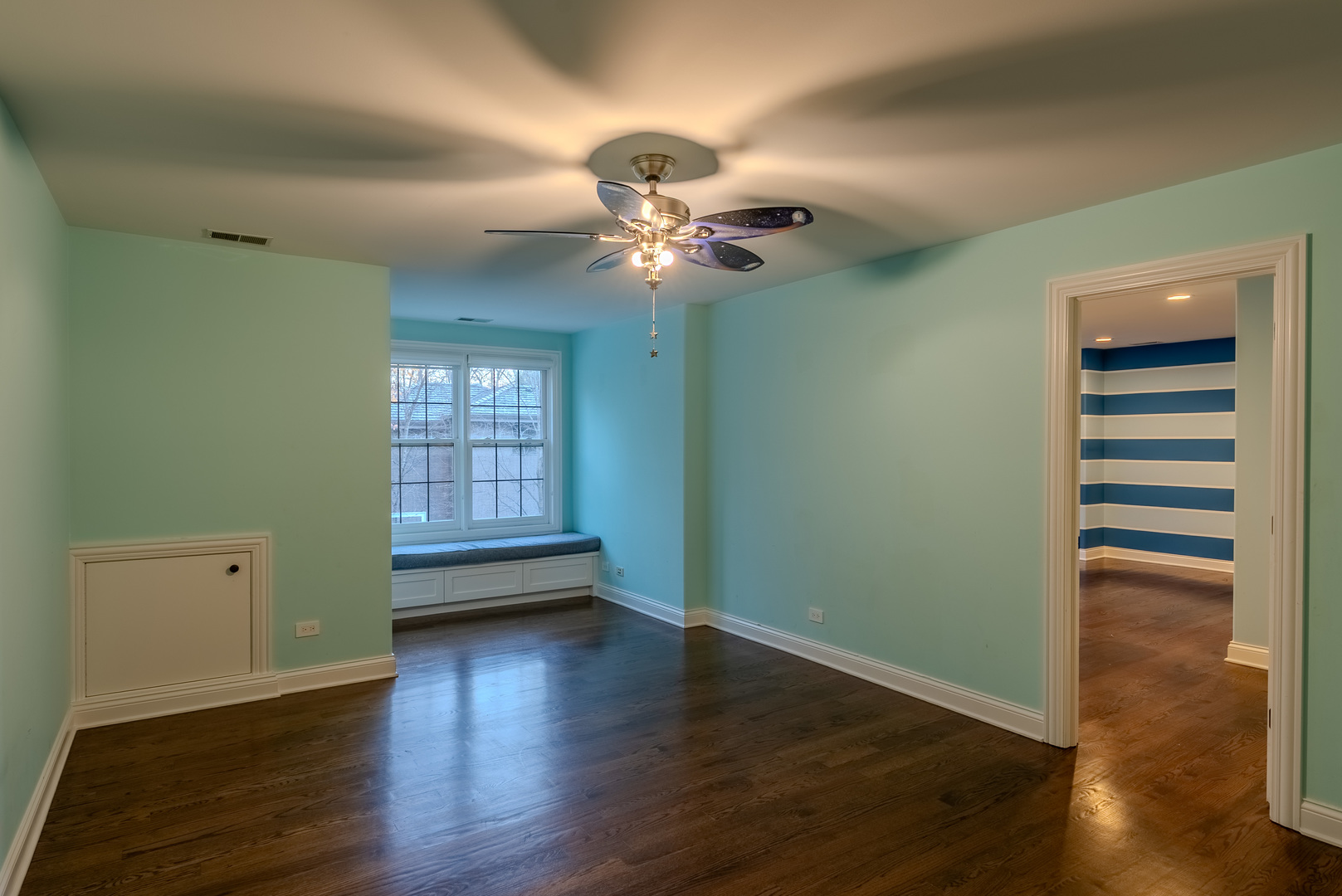 863 Bittersweet Drive Northbrook, IL 60062 - Photo 30 of 51 wooden floor in an empty room with a window