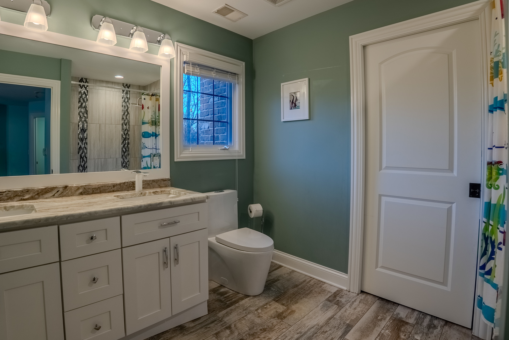 863 Bittersweet Drive Northbrook, IL 60062 - Photo 31 of 51 a bathroom with a granite countertop toilet sink and mirror