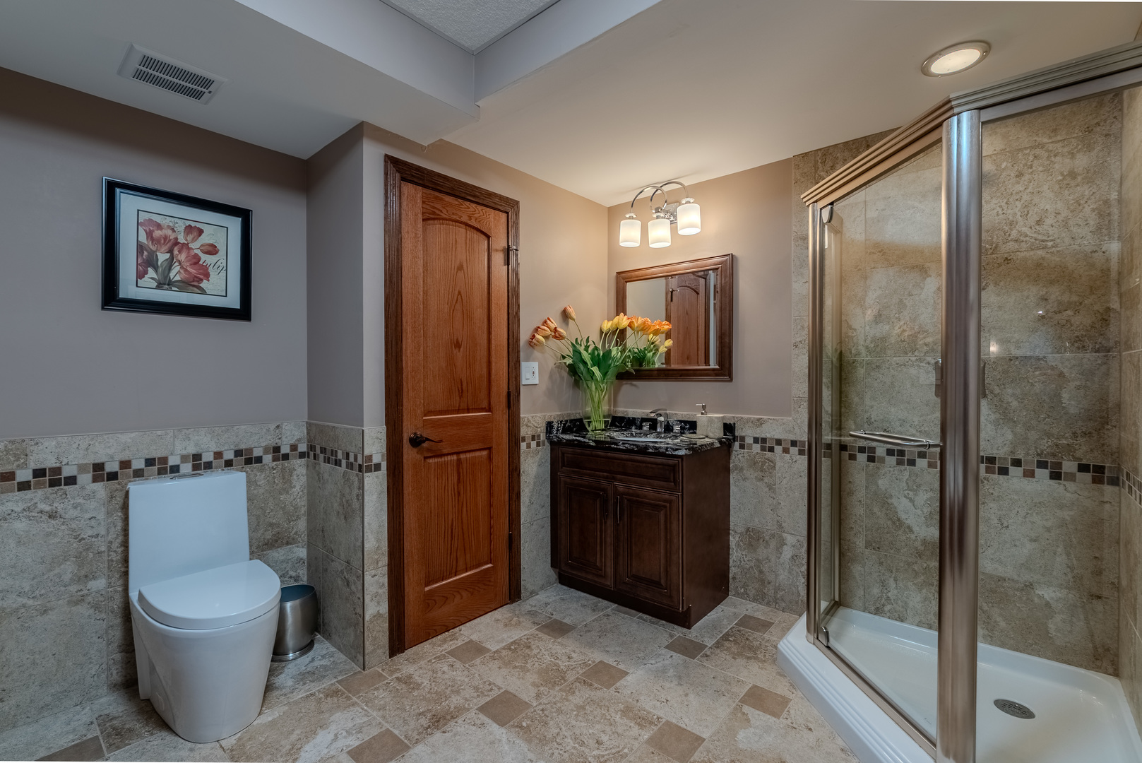 863 Bittersweet Drive Northbrook, IL 60062 - Photo 44 of 51 a bathroom with a granite countertop sink toilet and shower