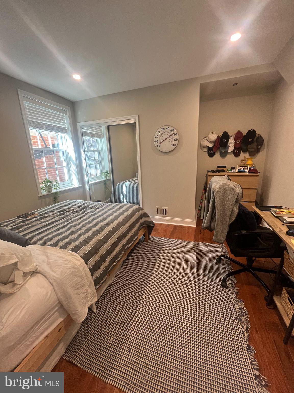 407 Cypress Street, Unit 1F Philadelphia, PA 19106 - Photo 11 of 14 a bedroom with a bed and wooden floor