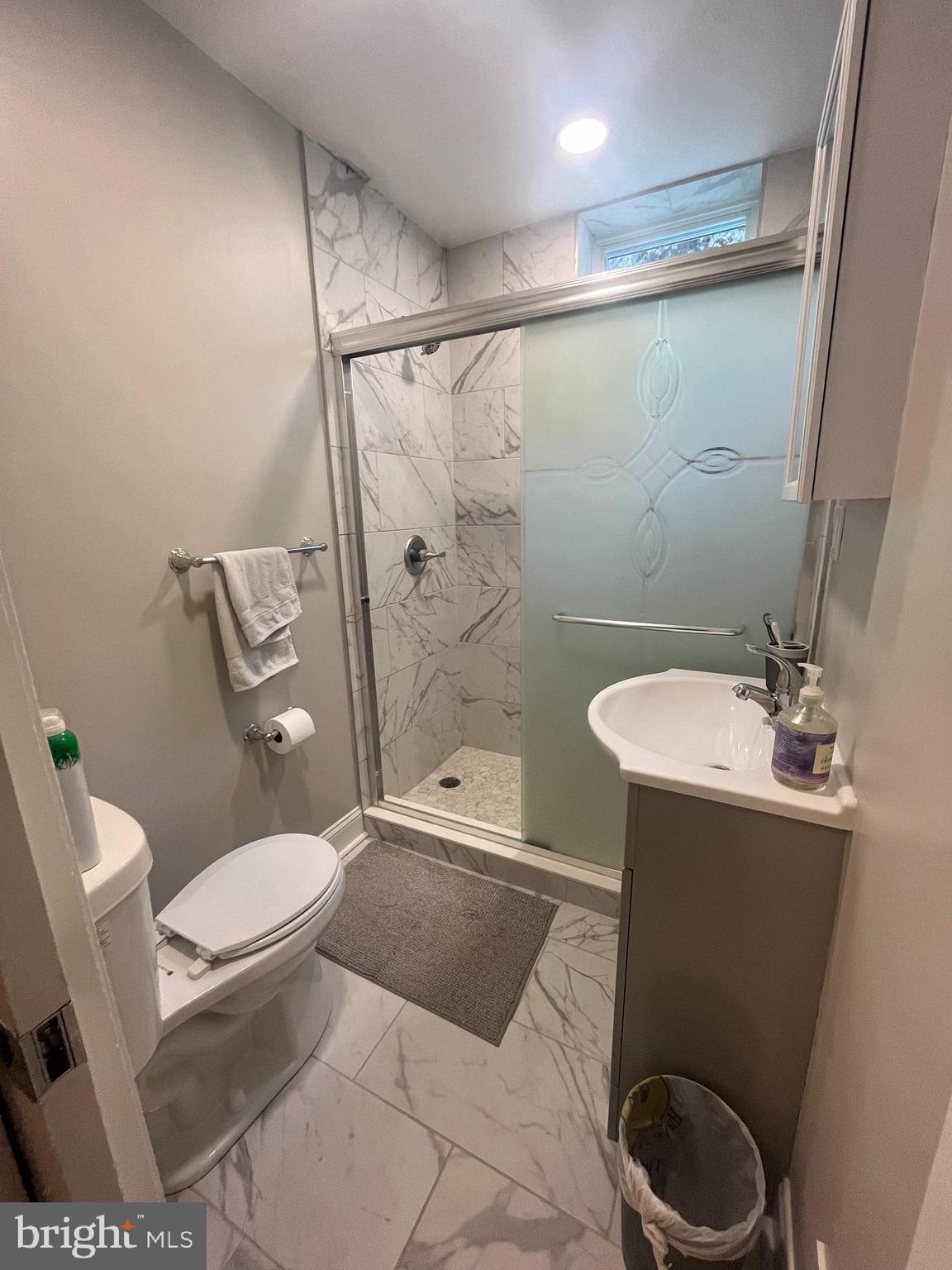 407 Cypress Street, Unit 1F Philadelphia, PA 19106 - Photo 8 of 14 a bathroom with a toilet a sink and a shower