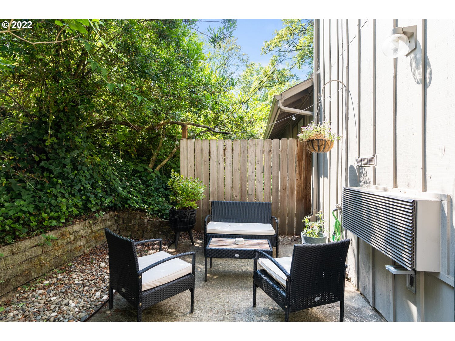 5503 Southwest Multnomah Boulevard Portland, OR 97219 - Photo 14 of 21 a backyard of a house with outdoor seating