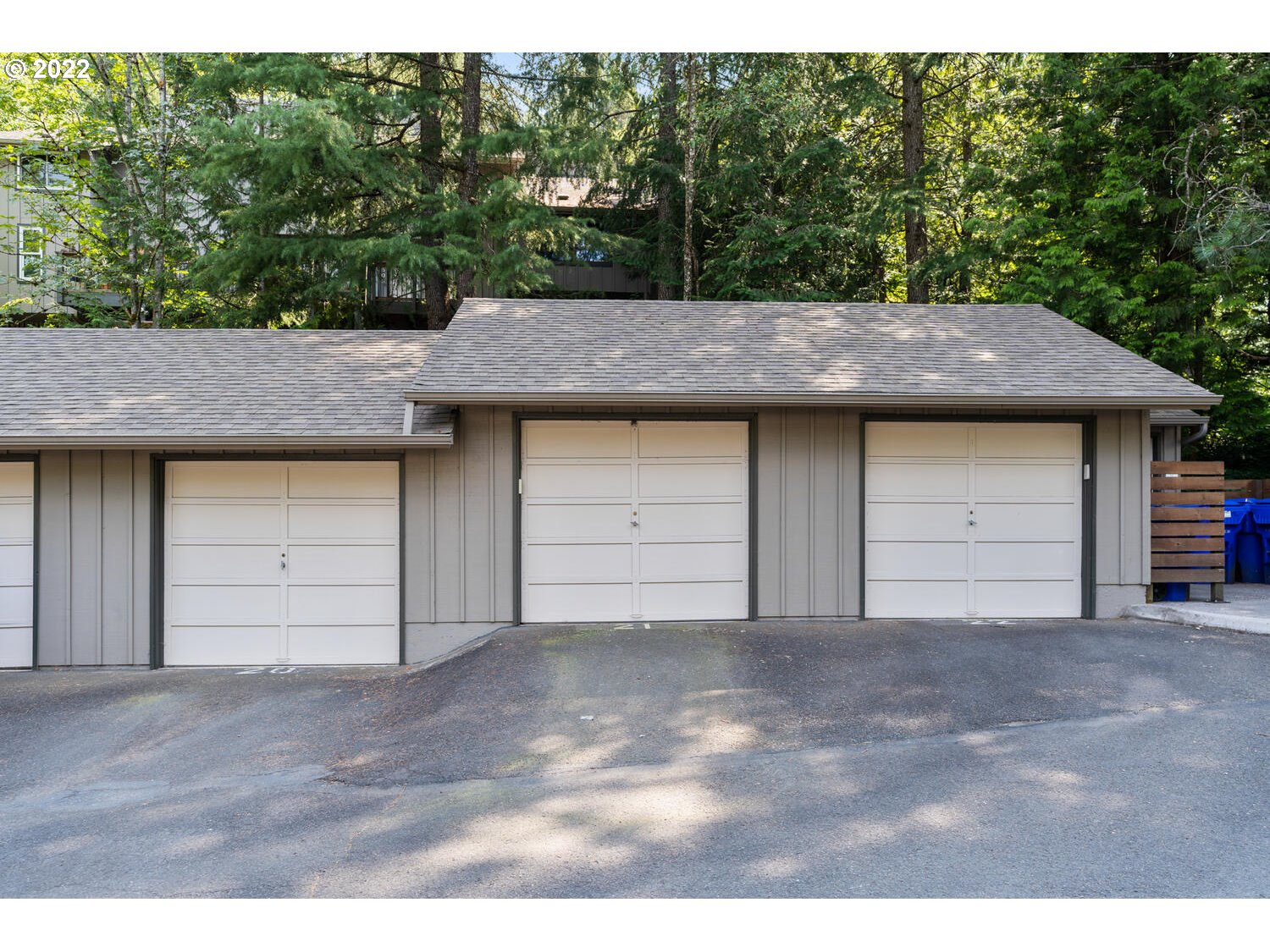 5503 Southwest Multnomah Boulevard Portland, OR 97219 - Photo 19 of 21 a front view of a house with a garden and garage