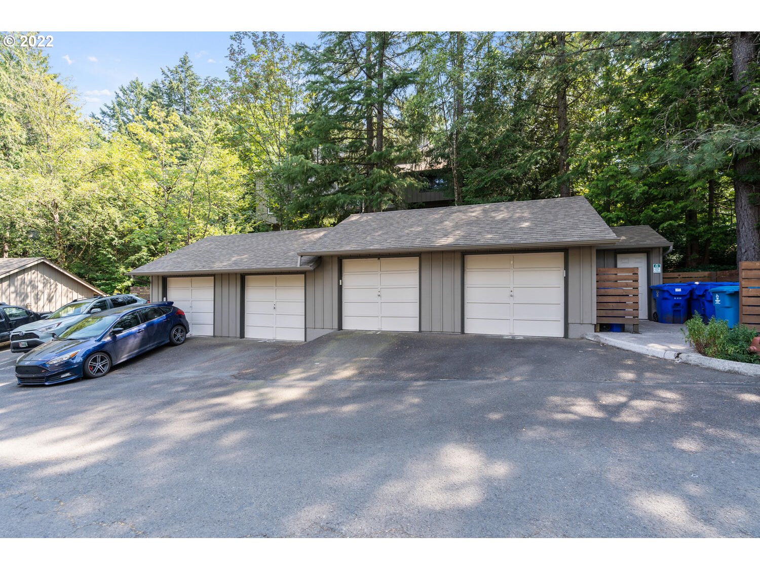 5503 Southwest Multnomah Boulevard Portland, OR 97219 - Photo 20 of 21 a view of a house with a yard and garage