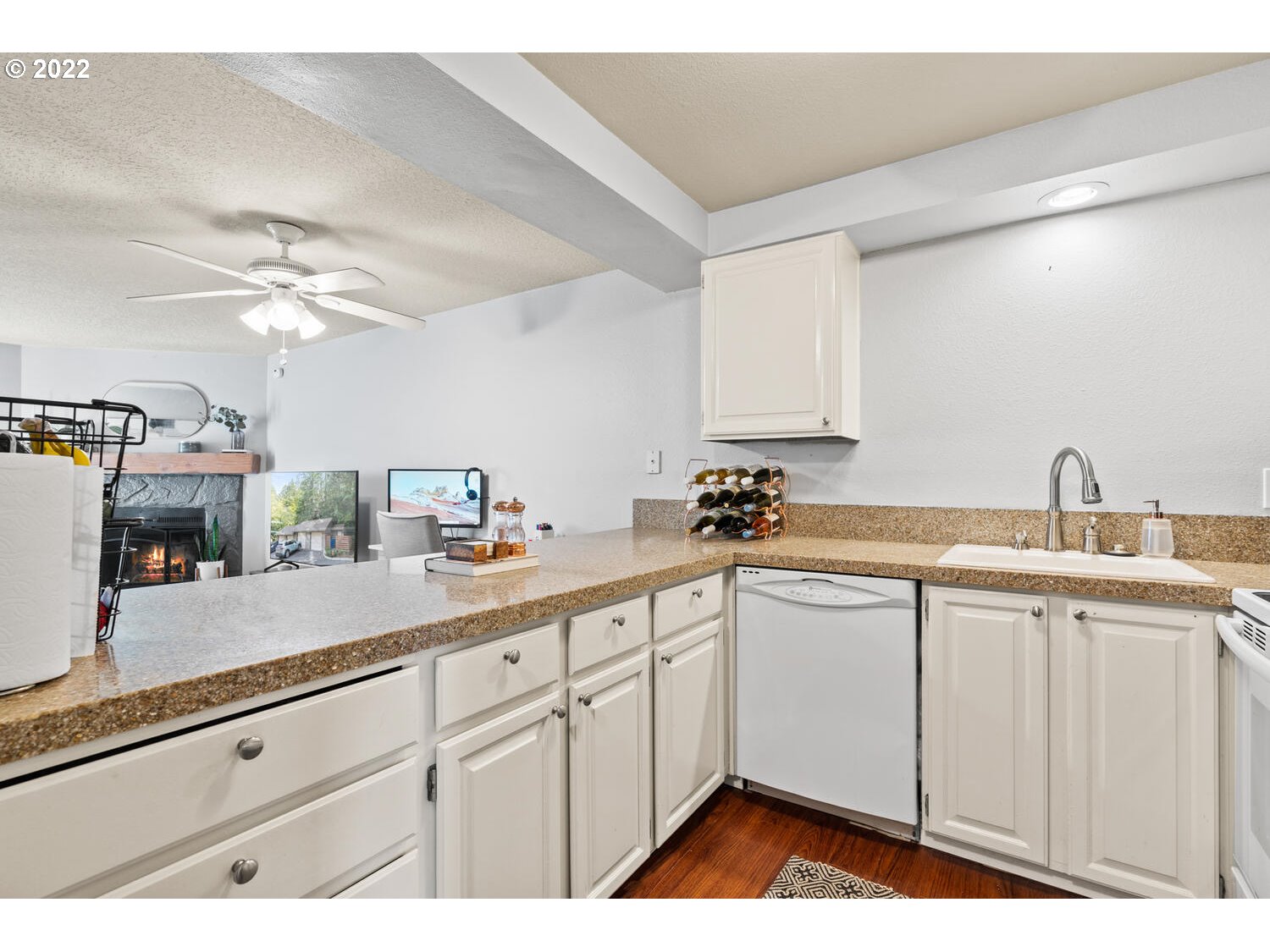 5503 Southwest Multnomah Boulevard Portland, OR 97219 - Photo 7 of 21 a kitchen with a sink cabinets and window