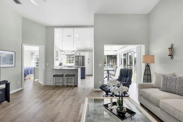 a living room with furniture and wooden floor