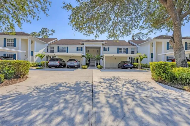 a front view of a residential houses with yard