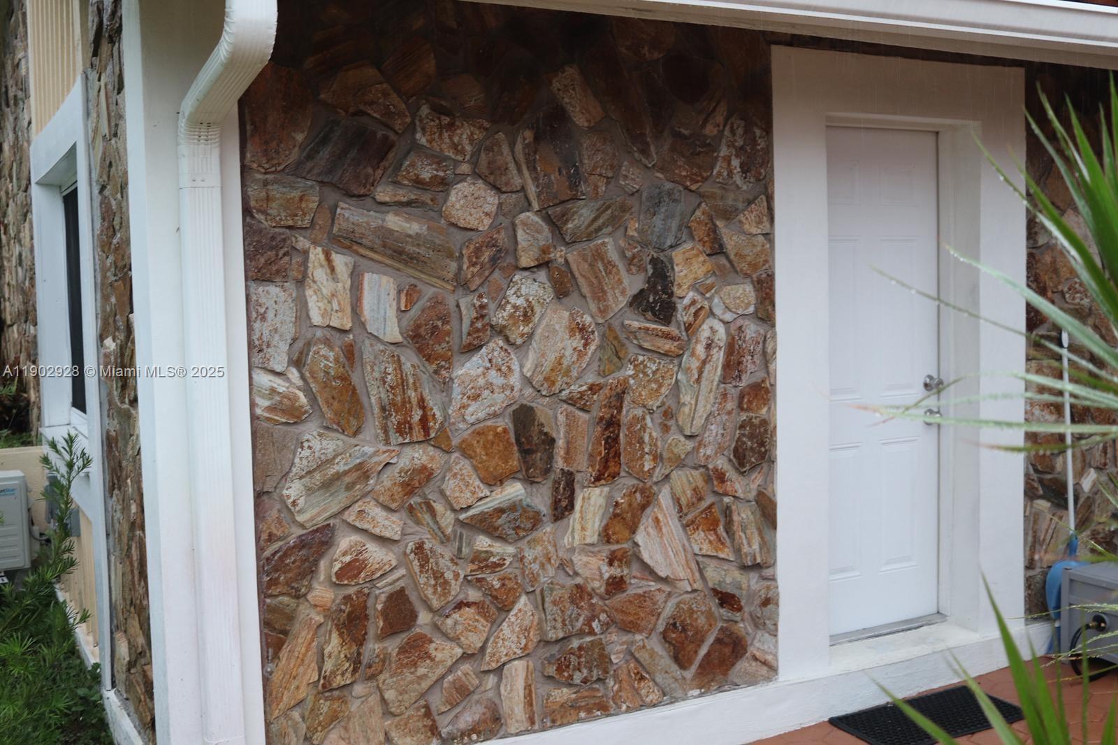 20022 Northwest 58th Court, Unit 1 Hialeah, FL 33015 - Photo 2 of 12 a bathroom with a shower and a glass door
