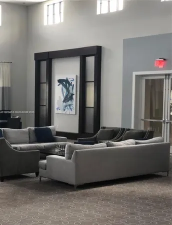 a living room with a couch and a window