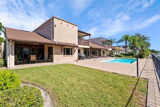 a bathroom with a granite countertop sink a toilet and a mirror