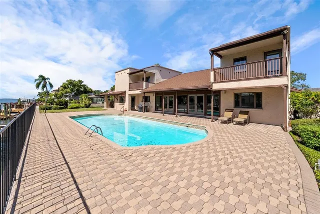 a bathroom with a sink a toilet and shower curtain