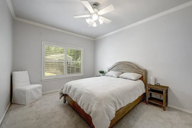 a bedroom with a bed and a chair