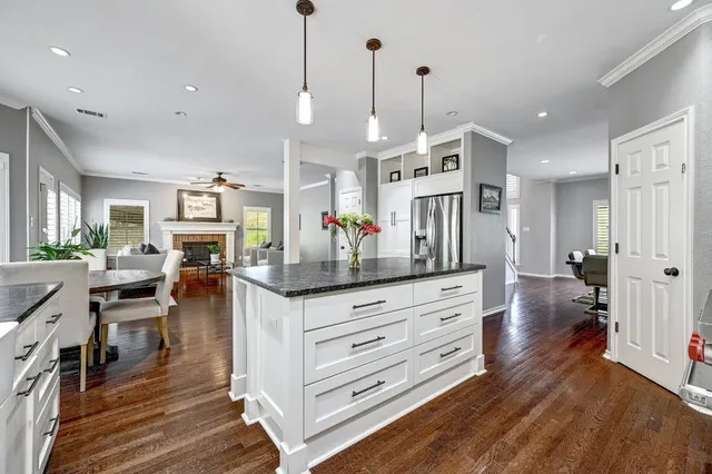 a view of center island of a kitchen and living room
