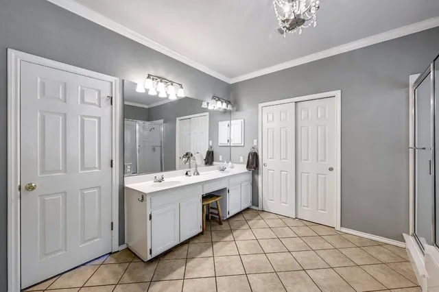 a bathroom with a sink a vanity and a mirror