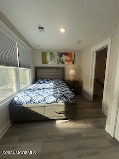 16 Elder Street, Unit 78 Mantoloking, NJ 08738 - Photo 16 of 26 a bed sitting in a room next to a window