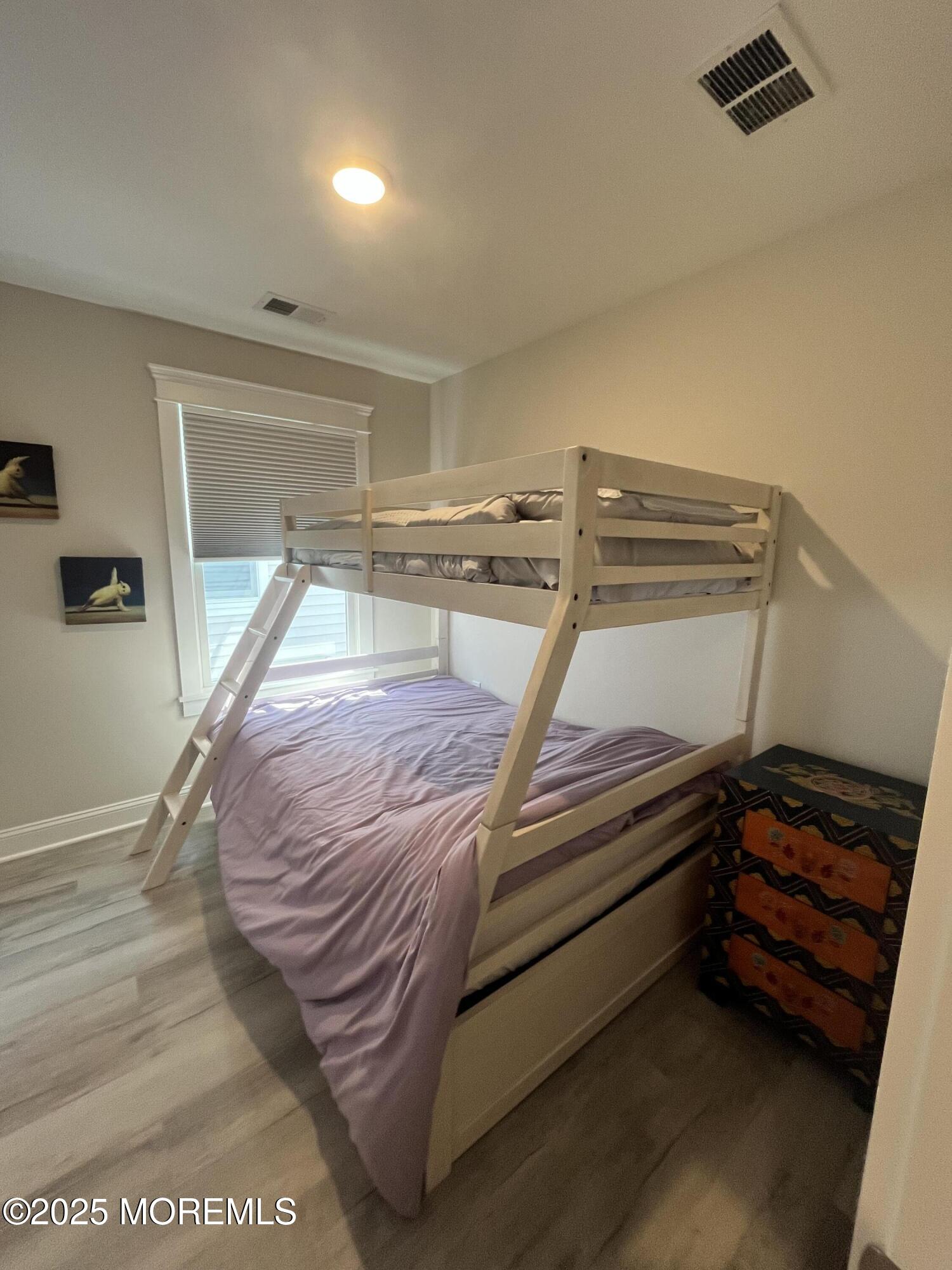 16 Elder Street, Unit 78 Mantoloking, NJ 08738 - Photo 19 of 26 a bedroom with a bed and a window