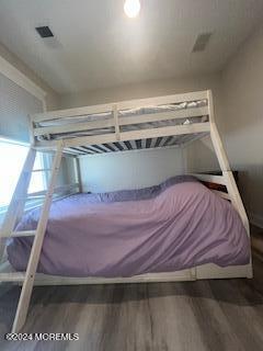 16 Elder Street, Unit 78 Mantoloking, NJ 08738 - Photo 20 of 26 a bed sitting in a bedroom next to a window