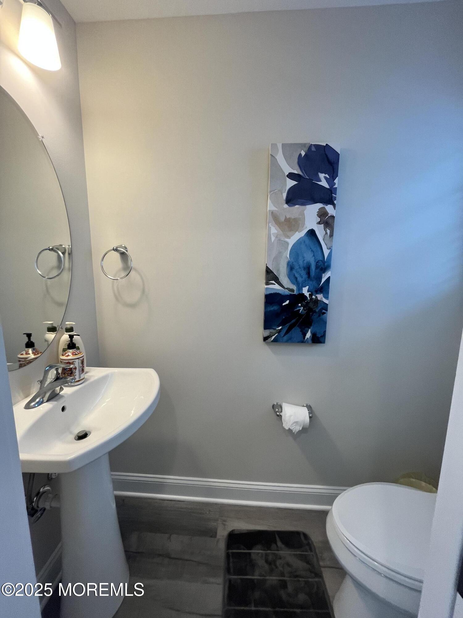 16 Elder Street, Unit 78 Mantoloking, NJ 08738 - Photo 24 of 26 a bathroom with a sink and a toilet