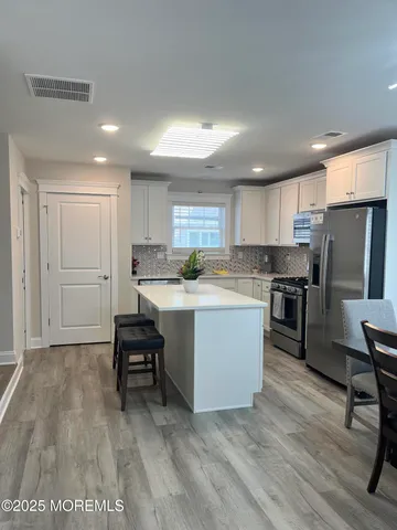 a view of a workspace with furniture