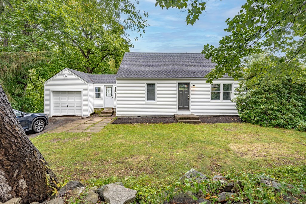 21 Wilbraham Road Monson, MA 01057 - Photo 1 of 26 a view of a house with backyard and sitting area