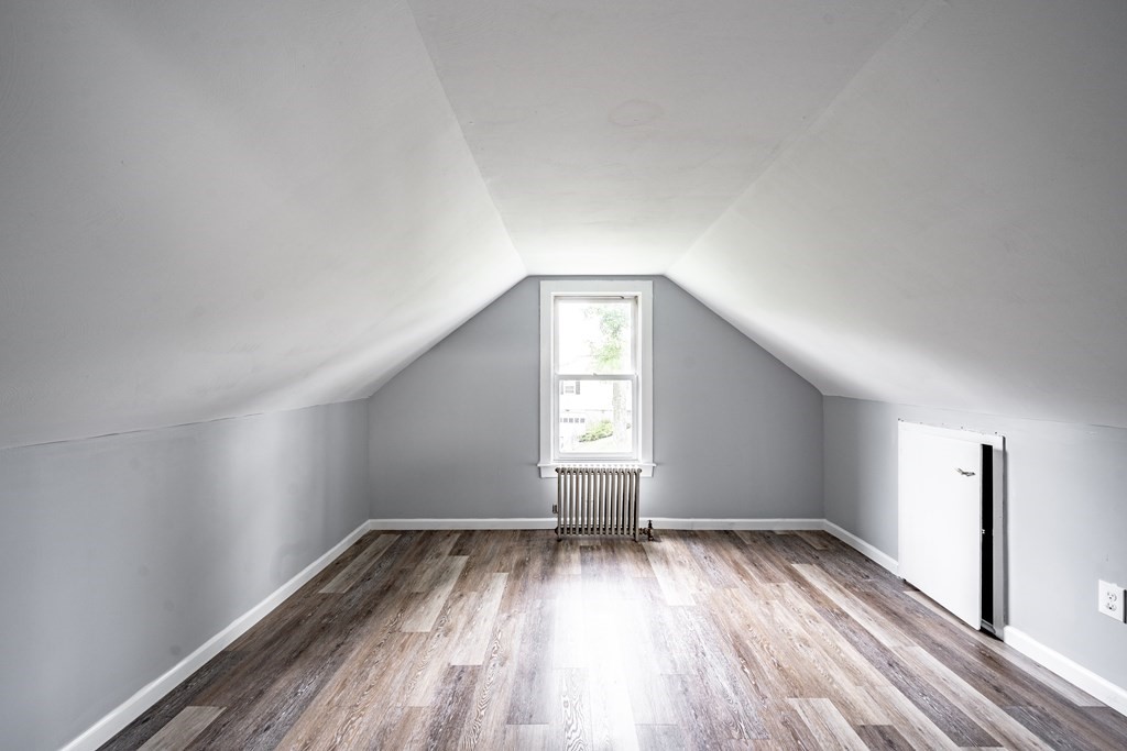 21 Wilbraham Road Monson, MA 01057 - Photo 17 of 26 an empty room with wooden floor and windows