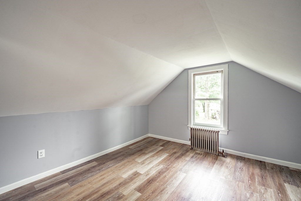 21 Wilbraham Road Monson, MA 01057 - Photo 18 of 26 an empty room with wooden floor and windows
