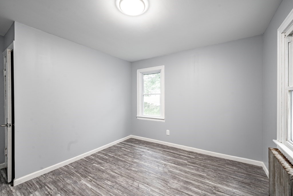21 Wilbraham Road Monson, MA 01057 - Photo 20 of 26 a view of empty room with wooden floor and fan