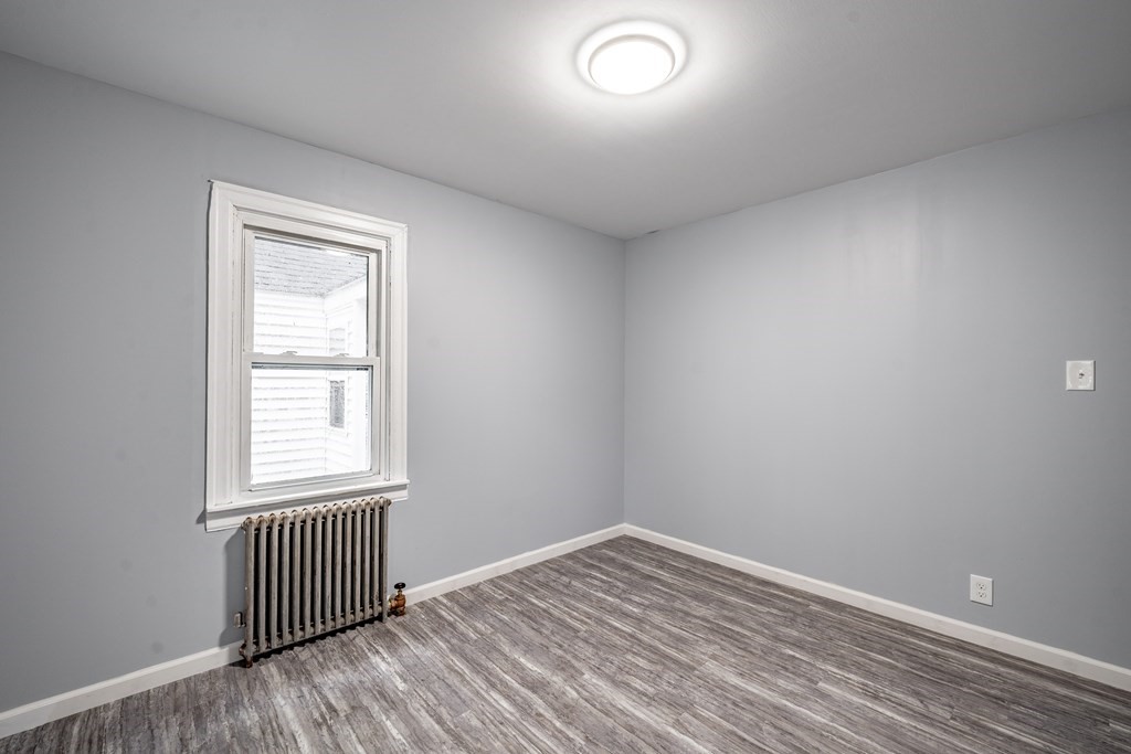 21 Wilbraham Road Monson, MA 01057 - Photo 21 of 26 an empty room with wooden floor and windows